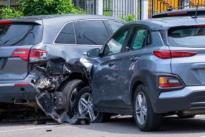 A car collides with another vehicle after a driver unexpectedly pulls out on a neighborhood street.