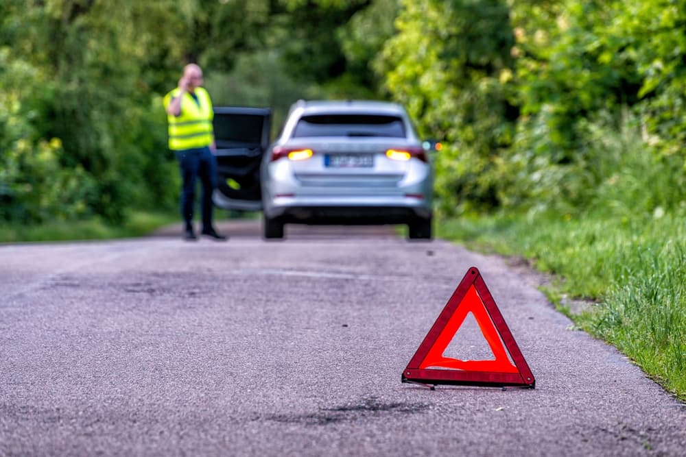 damaged car on a country road after a breakdown
