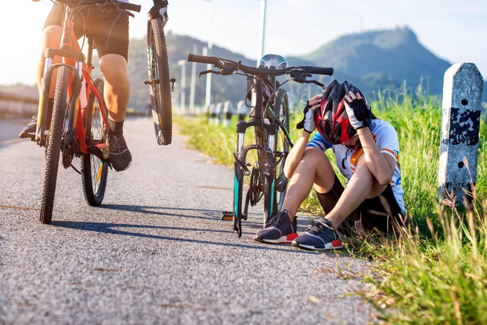 A woman cyclist suffered head injury while wearing Helmet on the road
