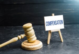 Compensation and judge's gavel. 